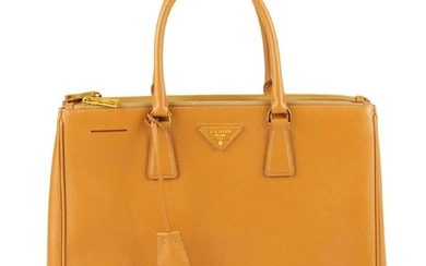 PRADA - a caramel Saffiano leather handbag. Crafted