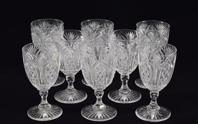 Set of 8 American cut glass water glasses. Arched and fan design pattern. Notched stems. Heavy