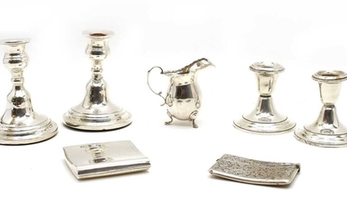 Silver items comprising two pairs of dwarf candlesticks