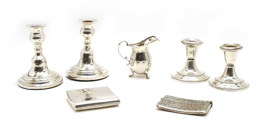 Silver items comprising two pairs of dwarf candlesticks