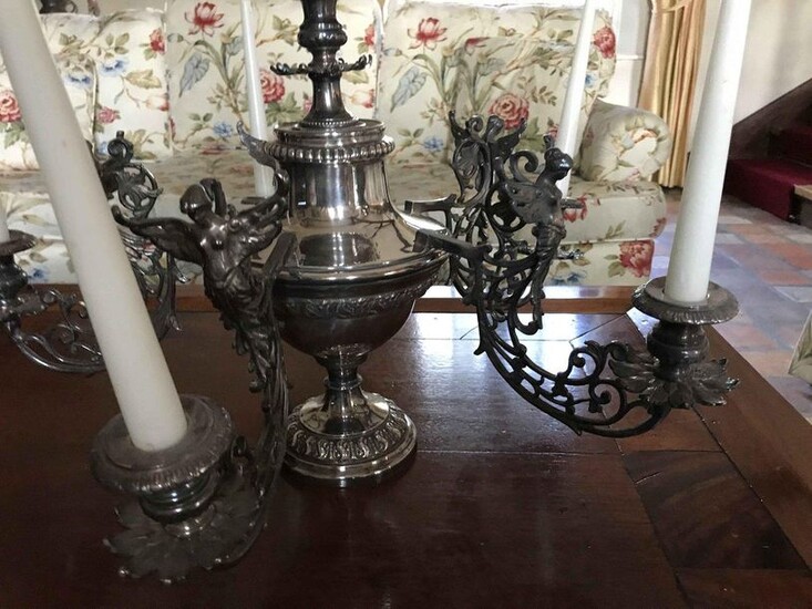 Silver plated metal travel candlestick with 6 arms of lights decorated with winged women's bust. Work probably Polish Height: 40cm Ref DAM78