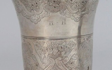 Silver tulip-shaped timbale engraved with flowers, staples and shells in two registers, monogrammed "H.H", resting on a pedestal decorated with a moulding of ova PARIS, 1761 (letter X). Master Goldsmith : Henri-Nicolas DEBRIE (Slight dent on the foot...