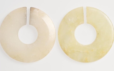 TWO CHINESE NEPHRITE JADE 'JUE' SLIT-RINGS EASTERN ZHOU (770-256 BC) OR HAN DYNASTY (202 BC-220 AD)
