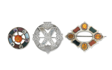Two Scottish gem-set and hardstone brooches and a silver brooch...