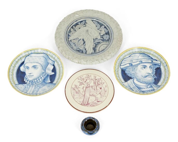 Two hand-painted porcelain plates, Late 19th century, unsigned, Painted in blue and yellow, one depicting a gentleman looking right, the other a woman looking left, 23.5cm each; together with a Victorian plate, both top and bottom rims moulded with...