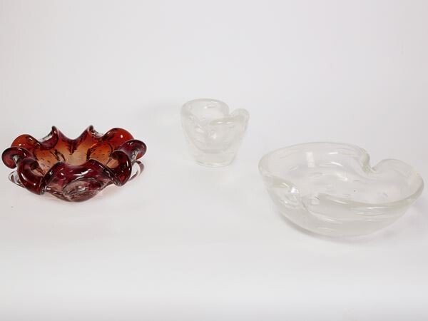 Two iridiscent clear ashtrays with bubbles and a red glass ashtray with bubbles Murano, 1950