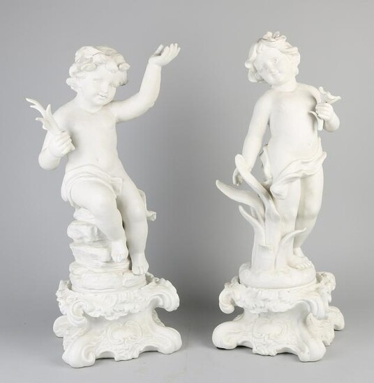 Two large German white Bisquit porcelain children on