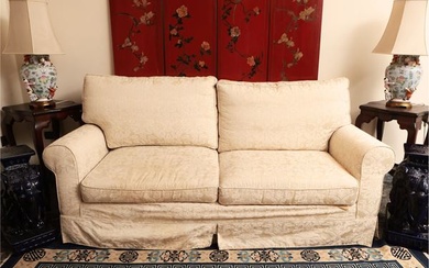 Upholstered sofa covered in damask