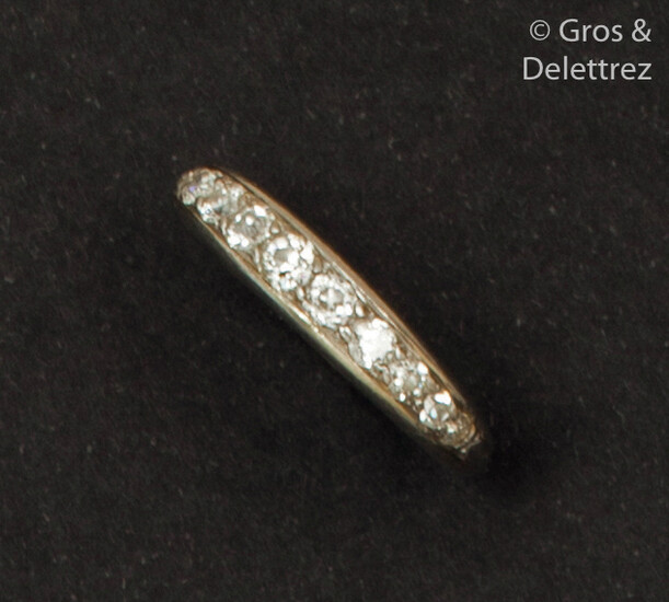 White gold wedding band, adorned with old-fashioned falling...