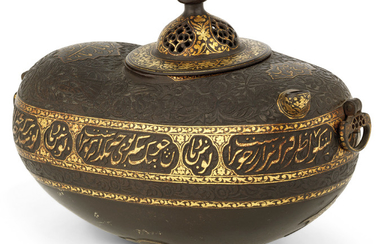 A GOLD OVERLAID CARVED STEEL BEGGAR'S BOWL (KASHKUL), SIGNED HAJJI 'ABBAS, QAJAR IRAN, SECOND HALF 19TH CENTURY