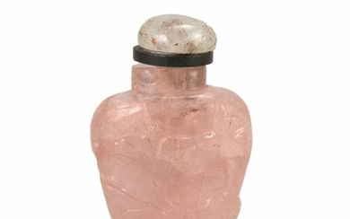 MINIATURE CHINESE PINK TOURMALINE SNUFF BOTTLE In spade shape, with relief floral design. Height 1.5". Quartz stopper.