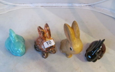 Two Newport rabbits and two crouching rabbits