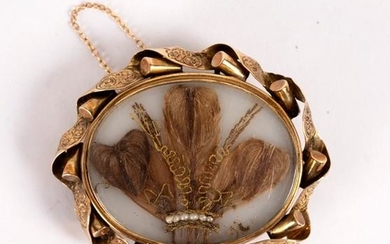 A Victorian brooch, the central panel set with the