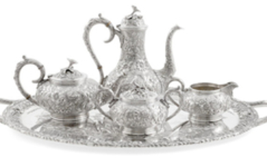 AN AMERICAN STERLING SILVER FOLIATE REPOUSSE-DECORATED FOUR-PIECE TEA AND COFFEE SERVICE WITH MATCHING TWO HANDLED TRAY