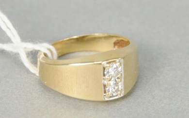 14 karat yellow gold ring set with two small diamonds