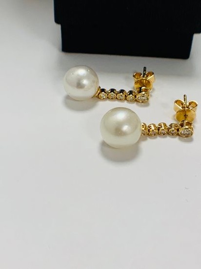 14ct Yellow Gold Pearl and Diamond earrings featuring,...