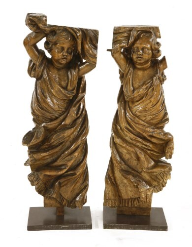 Two carved limewood cherubs