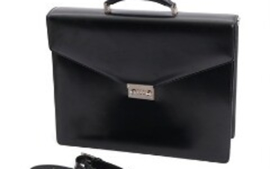 1918/1210 - Salvatore Ferragamo: A black laquered leather briefcase with detachable shoulder strap. H. incl. handle 36. L. 41.5. W. 10 cm.