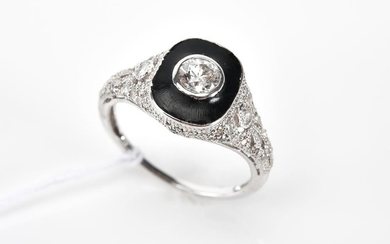 A BLACK ENAMEL AND DIAMOND RING IN 18CT WHITE GOLD