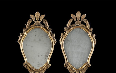 A pair of small giltwood mirrors. 18th century (cm 75x42) (candle holders missing, defects)