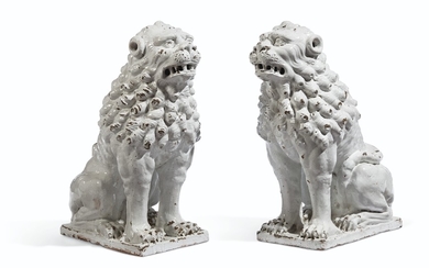 A PAIR OF ITALIAN FAIENCE WHITE-GLAZED LIONS, 19TH/20TH CENTURY