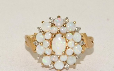9ct gold ladies Opal and Diamond cluster ring in a good ope...
