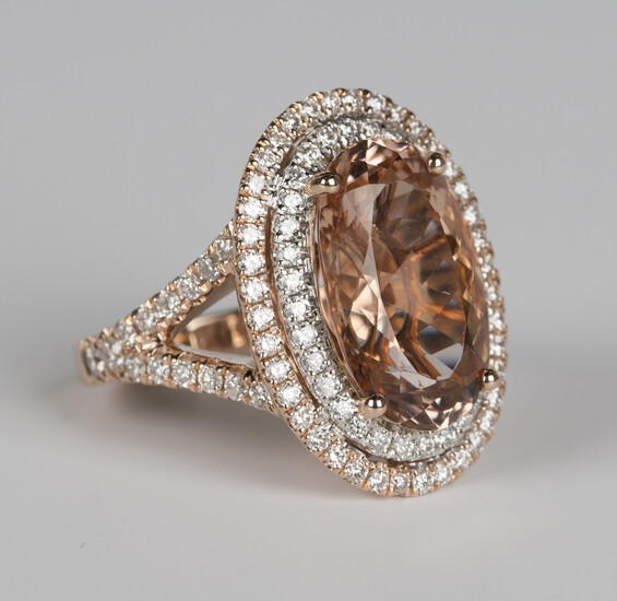 A 14ct rose gold, peach morganite and diamond oval cluster ring, claw set with an oval cut peach mor