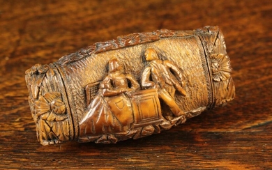 A 18th Century Carved Coquilla Nut Snuff Box. The hinged rectangular cushion lid relief carved with