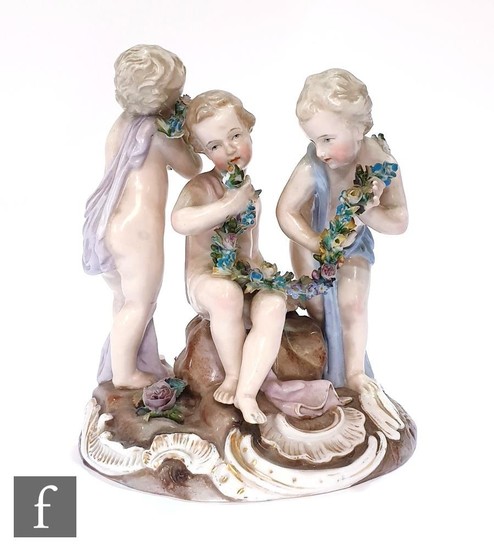 A 19th Century continental figural group of three young boys...