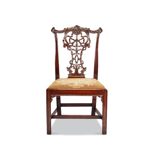 A 19th century Chippendale style carved mahogany dining chai...