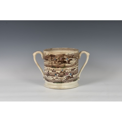A 19th century twin handled loving cup of large proportions,...