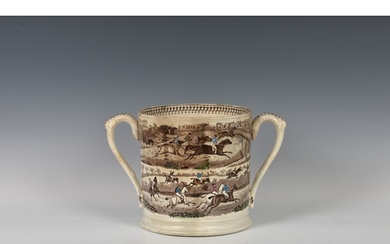 A 19th century twin handled loving cup of large proportions,...