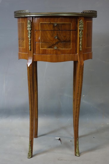 A 20th century French walnut oval lamp table, with 3 drawers...