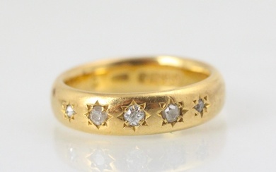 A 22ct yellow gold diamond set ring, the five graduated old ...