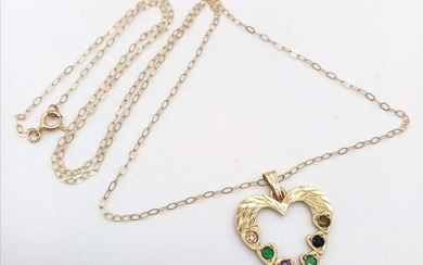 A 9K yellow gold 'DEAREST' heart necklace set with...