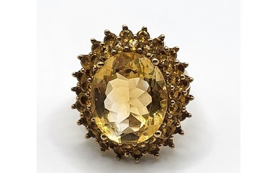 A 9ct yellow gold and citrine cocktail ring, set with a larg...