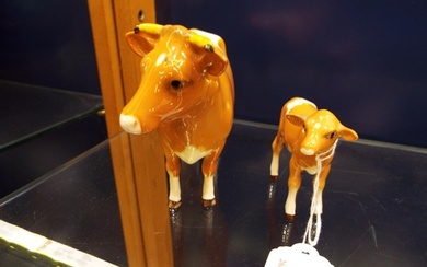 A Beswick Guernsey cow and calf