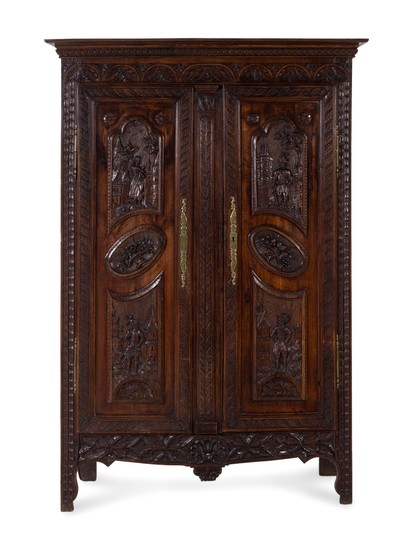 A Brittany Style Carved Oak Armoire