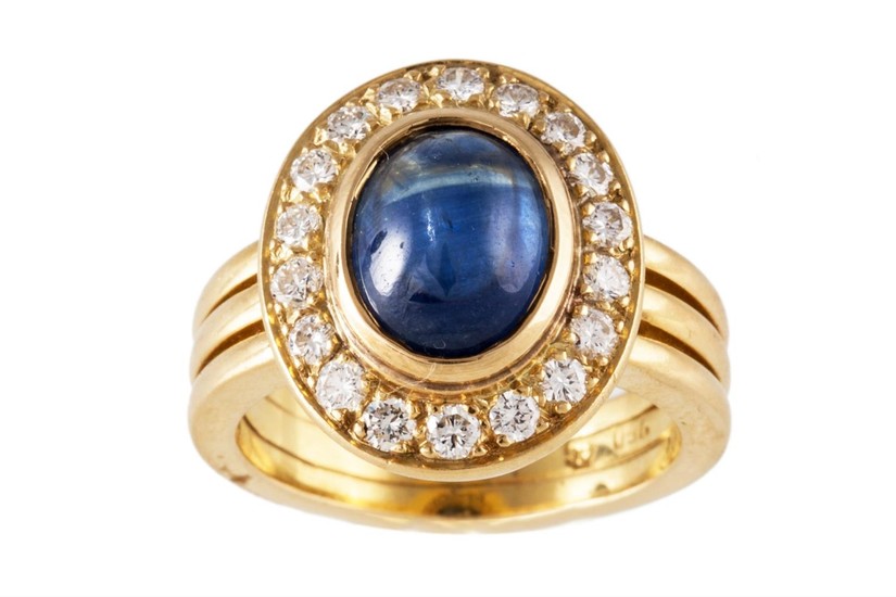 A CABACHON SAPPHIRE AND DIAMOND CLUSTER RING, mounted in 18c...