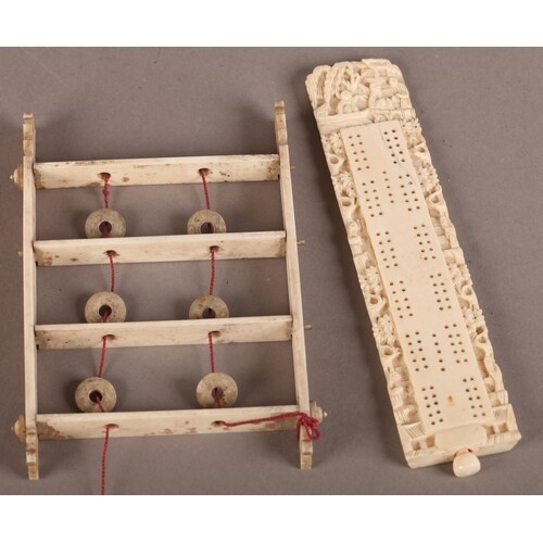 A CHINESE IVORY CRIBBAGE BOARD of slightly tapered rectangul...