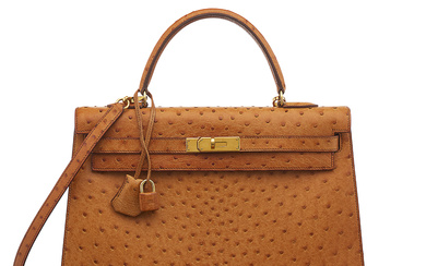 A COGNAC OSTRICH LEATHER SELLIER KELLY 35 WITH GOLD HARDWARE...