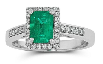 A COLOMBIAN EMERALD AND DIAMOND RING in platinum, set