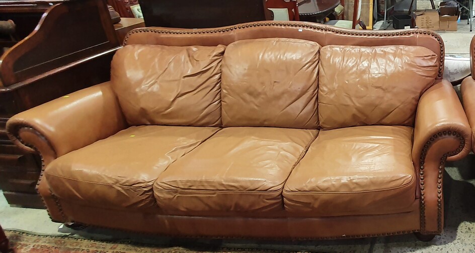 A CONTEMPORARY DANISH LEATHER THREE SEATER SETTEE