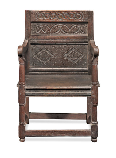 A Charles II joined oak panel-back open armchair, North Country, circa 1670 and later