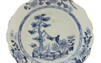 A Chinese blue and white plate with a lobed rim