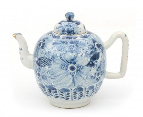 A Chinese blue and white porcelain teapot with stylized floral and fish decoration, 19th century.