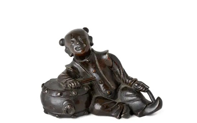 A Chinese bronze 'boy drummer' paper weight Ming dynasty Cast as a...