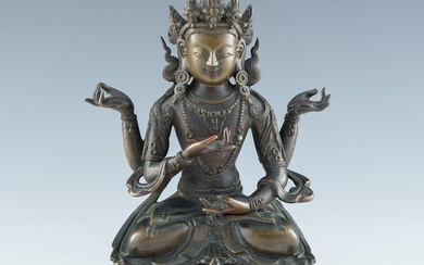 A Chinese bronze statue of four-armed Guanyin, late 18th century