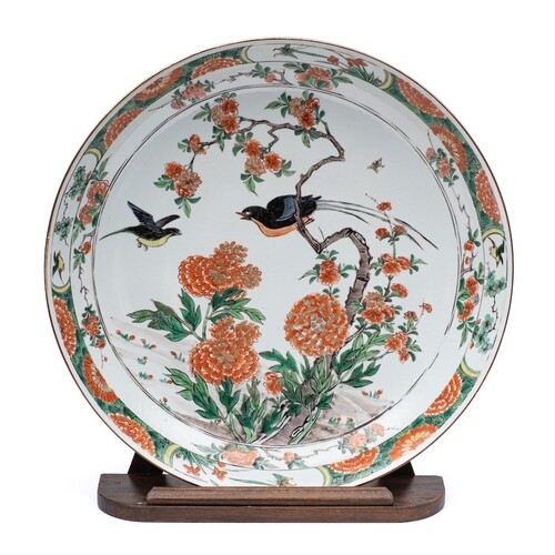 A Chinese famille verte 'birds and peony' charger: painted w...