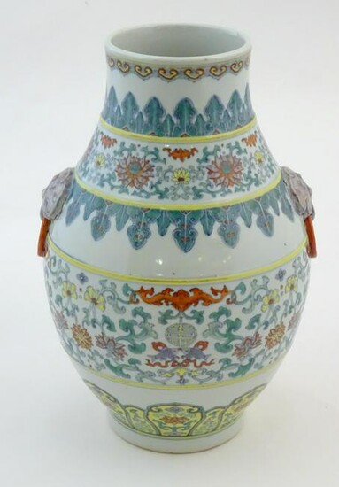 A Chinese famille verte vase with a bulbous body with